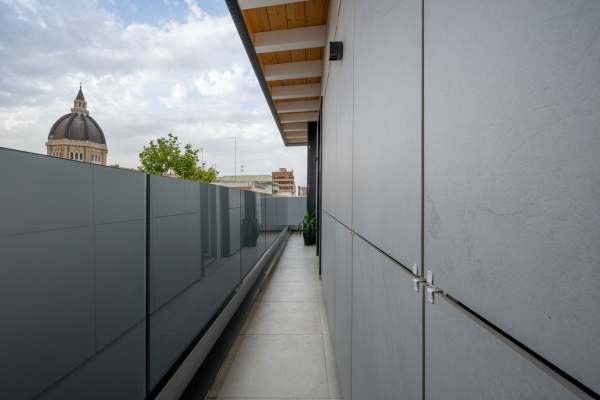 Detail of porcelain stoneware panel installation on ventilated facade system